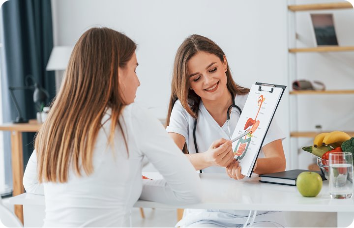 A health coach talking a client through a wellness plan