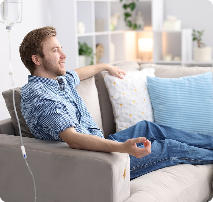 A client resting comfortably during an IV hydration session