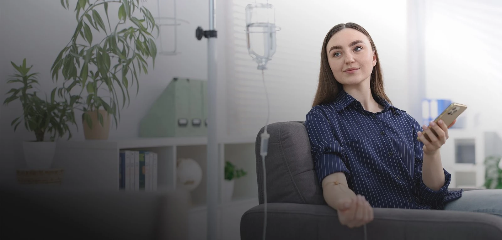 A client relaxing on a sofa during an IV hydration session